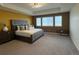 Main bedroom with large bed and window views at 2521 E 163Rd Pl, Thornton, CO 80602