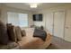 Spacious bedroom with large closet and mounted TV at 2521 E 163Rd Pl, Thornton, CO 80602