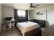 Bright bedroom featuring a comfortable bed and workspace at 2521 E 163Rd Pl, Thornton, CO 80602