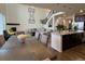 Open concept dining area with hardwood floors and large windows at 2521 E 163Rd Pl, Thornton, CO 80602