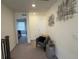 Upper hallway with access to bedrooms and a comfortable sitting area at 2521 E 163Rd Pl, Thornton, CO 80602
