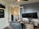 Home office with double monitors, view into kitchen, and French doors at 2521 E 163Rd Pl, Thornton, CO 80602