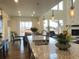 Spacious kitchen boasts an island, granite countertops, and modern pendant lighting at 2521 E 163Rd Pl, Thornton, CO 80602