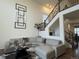 Open living room features a large sectional sofa and high ceilings at 2521 E 163Rd Pl, Thornton, CO 80602