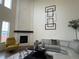 Living area with a fireplace and large windows at 2521 E 163Rd Pl, Thornton, CO 80602