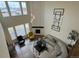 Spacious living room with a corner fireplace and large windows at 2521 E 163Rd Pl, Thornton, CO 80602