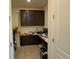 Home office with built-in cabinetry and workspace at 2521 E 163Rd Pl, Thornton, CO 80602