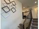 Modern staircase with metal railing leading to the second floor at 2521 E 163Rd Pl, Thornton, CO 80602
