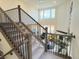 Elegant staircase overlooking the living room at 2521 E 163Rd Pl, Thornton, CO 80602