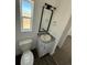 Modern bathroom with granite vanity, updated fixtures, and a window at 61400 E 56 Ave, Strasburg, CO 80136