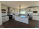 Bright and modern kitchen with stainless steel appliances and granite countertops at 61400 E 56 Ave, Strasburg, CO 80136
