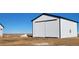 New outbuilding perfect for storage, workshop, or other versatile uses at 61400 E 56 Ave, Strasburg, CO 80136