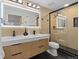 Modern bathroom showcases a double vanity, sleek black fixtures, a large mirror, and a glass-enclosed shower at 365 S Xapary St, Aurora, CO 80012