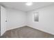 Cozy bedroom featuring carpeted floors, neutral walls, and a window at 365 S Xapary St, Aurora, CO 80012