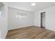 Bright bedroom featuring hardwood floors, neutral walls, and a closet at 365 S Xapary St, Aurora, CO 80012