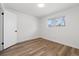 Bright bedroom featuring hardwood floors, neutral walls, and a window at 365 S Xapary St, Aurora, CO 80012