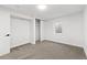 Bright bedroom featuring carpeted floors, neutral walls, and a closet at 365 S Xapary St, Aurora, CO 80012