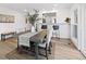 Bright dining room features modern table and chairs, complemented by stylish decor and natural light from nearby window at 365 S Xapary St, Aurora, CO 80012