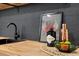 Modern kitchen featuring butcher block countertops, and sleek black faucet at 365 S Xapary St, Aurora, CO 80012