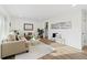 Bright living room with neutral tones, hardwood floors, and stylish decor at 365 S Xapary St, Aurora, CO 80012