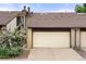 Charming townhome with a two car garage and manicured landscaping at 1159 S Otis Pl, Lakewood, CO 80232