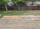 Wooden deck with a spacious, fenced yard at 2832 S Mobile St, Aurora, CO 80013