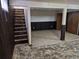 Basement area with stairs, storage, and potential for a versatile living space at 2832 S Mobile St, Aurora, CO 80013