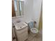 Bathroom showcasing vanity, toilet and enclosed yellow-tiled shower at 2832 S Mobile St, Aurora, CO 80013