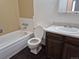 Bathroom boasts a combination tub and shower with a vanity sink at 2832 S Mobile St, Aurora, CO 80013