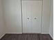 Bedroom features hard surface floors and a closet for storage at 2832 S Mobile St, Aurora, CO 80013
