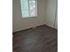 This bedroom has hard surface floors, a window and a closet for storage at 2832 S Mobile St, Aurora, CO 80013