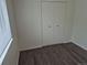 Bedroom features hard surface floors and a large closet for storage at 2832 S Mobile St, Aurora, CO 80013