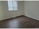 A spacious bedroom features a ceiling fan and wood-look floors at 2832 S Mobile St, Aurora, CO 80013