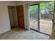 The dining room area featuring a wooden closet door and sliding glass doors to a wooden deck at 2832 S Mobile St, Aurora, CO 80013