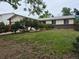 Charming single-story home featuring a lush lawn, mature trees and inviting curb appeal at 2832 S Mobile St, Aurora, CO 80013