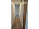 A long hallway with wood floors and a closet door at 2832 S Mobile St, Aurora, CO 80013