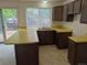 A kitchen features ample counter space, a double sink beneath a window, and cabinets at 2832 S Mobile St, Aurora, CO 80013