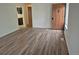 Open living room with wood-look flooring and natural light at 2832 S Mobile St, Aurora, CO 80013