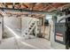 Unfinished basement with exposed beams, concrete floor, ductwork, and furnace, ready for customization at 120 W Bayaud Ave, Denver, CO 80223