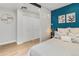 Stylish bedroom with a cozy bed, modern lighting, and closet space, offering a comfortable and relaxing retreat at 120 W Bayaud Ave, Denver, CO 80223