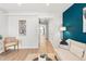 Bright hallway view showcases the home's neutral palette, storage, and natural light at 120 W Bayaud Ave, Denver, CO 80223