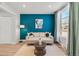 Bright living room features modern decor, a large window, and stylish furnishings, perfect for relaxing and entertaining at 120 W Bayaud Ave, Denver, CO 80223