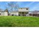 Spacious backyard with green grass, shed, and covered patio at 10645 Moore Ct, Broomfield, CO 80020