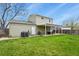 Expansive green backyard with shed and a covered patio at 10645 Moore Ct, Broomfield, CO 80020