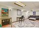 Finished basement featuring an entertainment area with a leather couch and pinball machine at 10645 Moore Ct, Broomfield, CO 80020