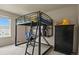 This bedroom features a lofted bed, desk, and dresser, maximizing space at 10645 Moore Ct, Broomfield, CO 80020