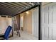 A view underneath a lofted bed showing a desk and storage, maximizing space at 10645 Moore Ct, Broomfield, CO 80020