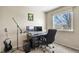 This bedroom provides a bright workspace with natural light and a dedicated music setup at 10645 Moore Ct, Broomfield, CO 80020