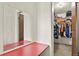 A walk-in closet with ample shelving and hanging storage. There is a mirror at 10645 Moore Ct, Broomfield, CO 80020