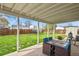 Covered patio features a dining set and a view of the fenced backyard at 10645 Moore Ct, Broomfield, CO 80020